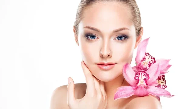 stock-photo-spa-woman-with-orchid-flower