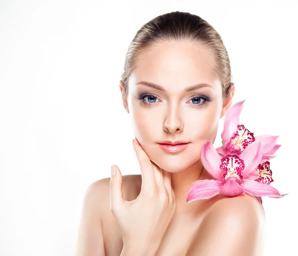 stock-photo-spa-woman-with-orchid-flower
